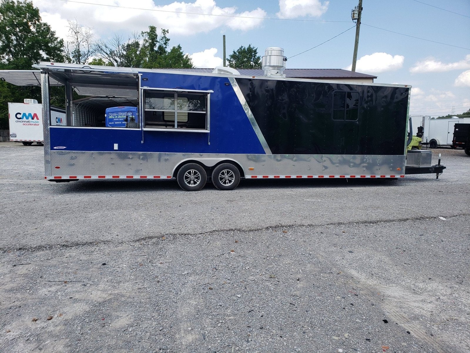 8.5′ x 30′ Black and Cobalt Blue BBQ Porch Style Concession Trailer — photo 2