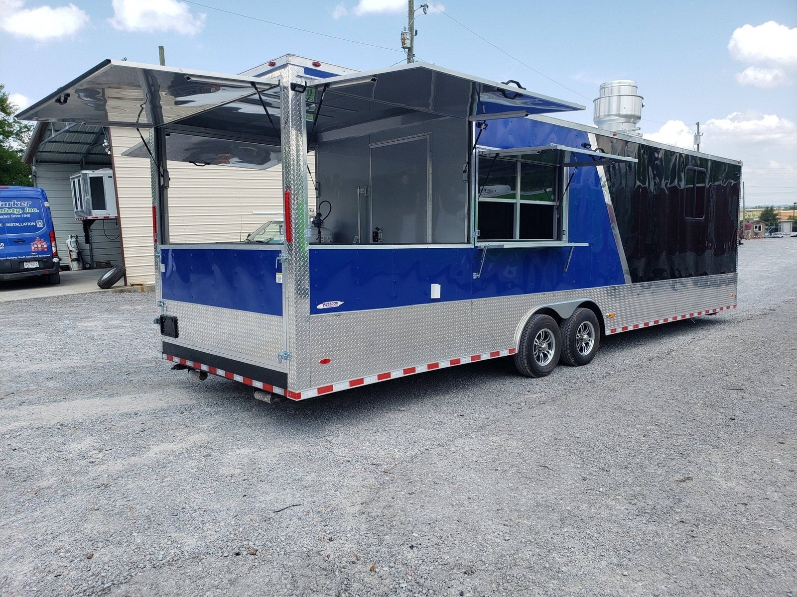8.5′ x 30′ Black and Cobalt Blue BBQ Porch Style Concession Trailer