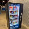 Used Crane Bevmax 3800 drink machine, glass-front elevator beverage vendor