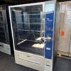 Refurbished Crane 472 Merchant Media combo vending machine with touchscreen